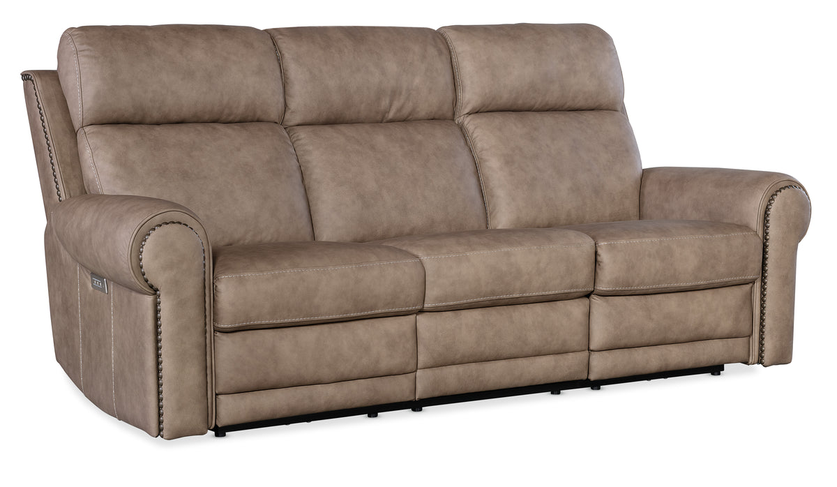 a brown couch with white stitching