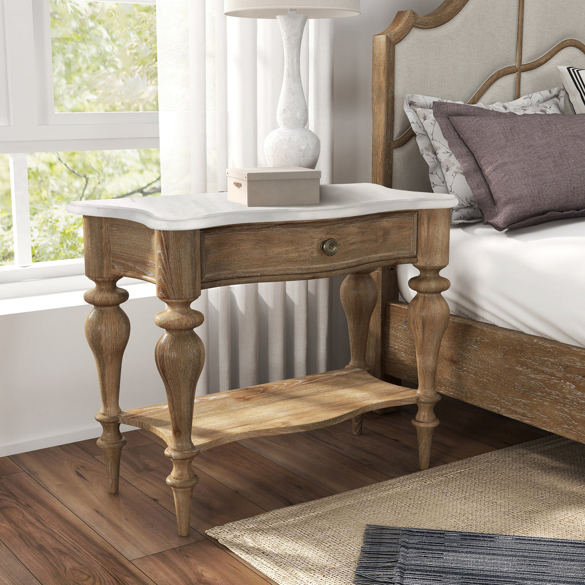 a table next to a bed