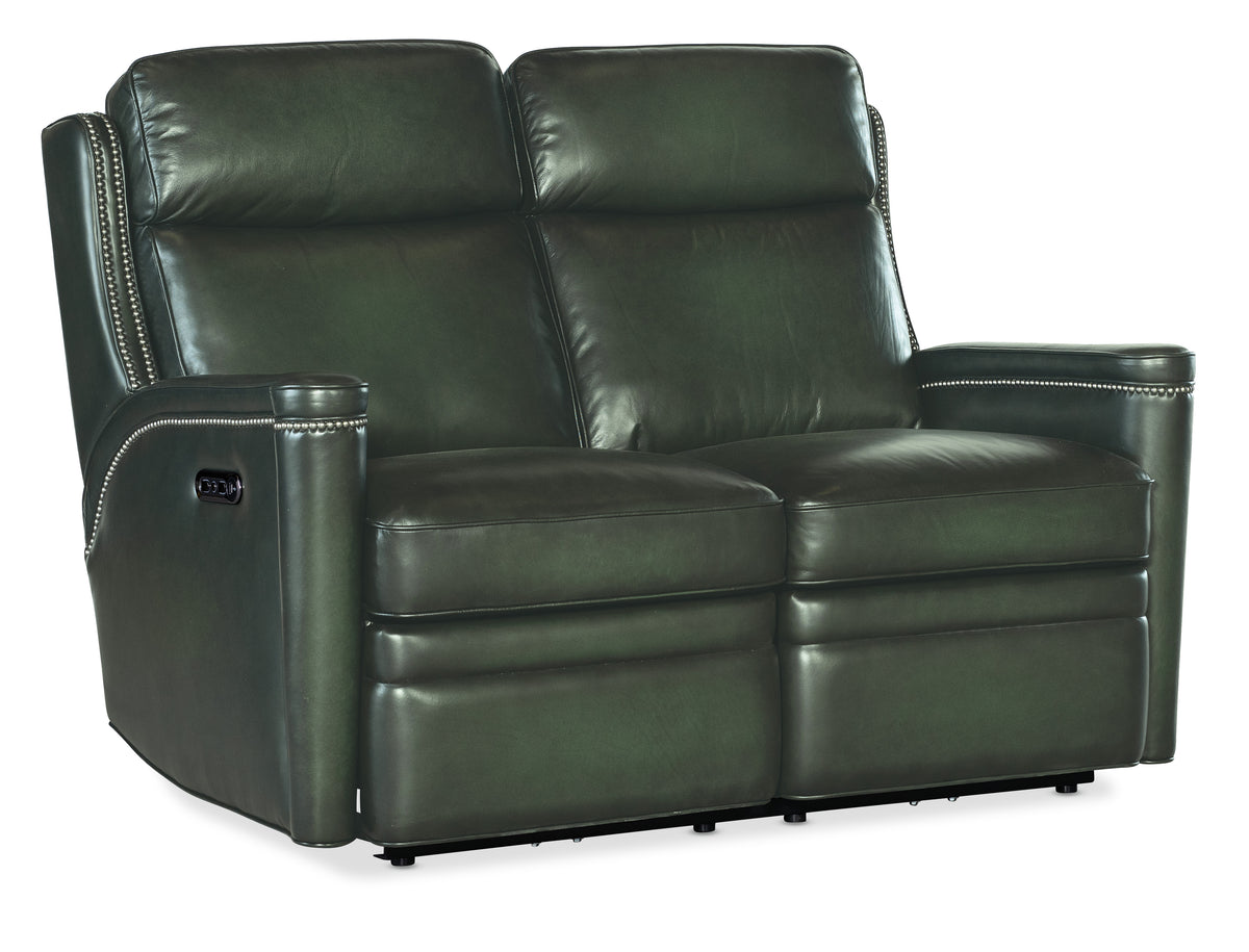 a black leather couch with two recliners
