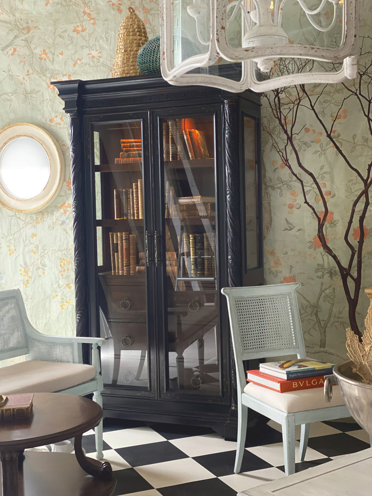 a black cabinet with books in it