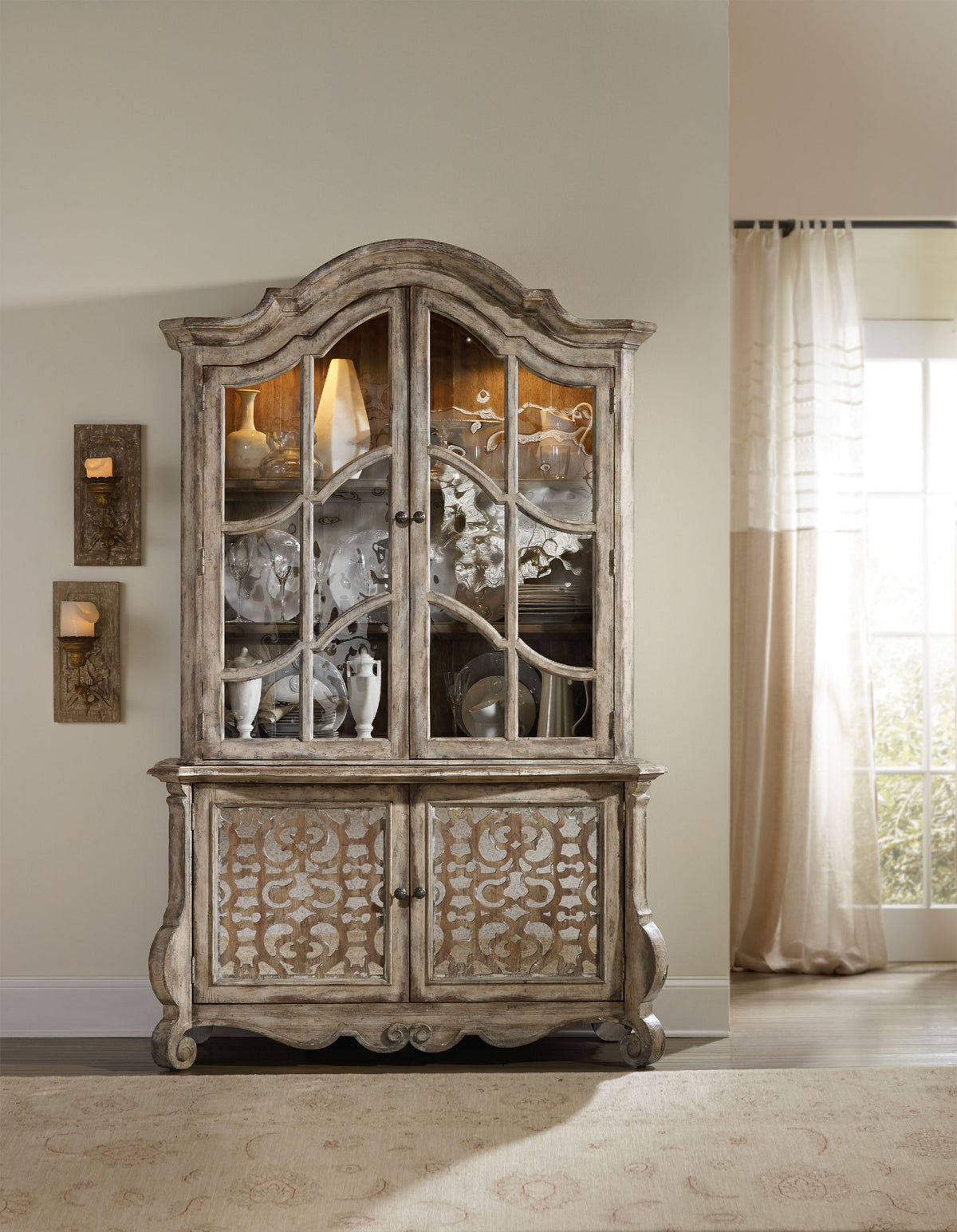a wooden cabinet with glass doors