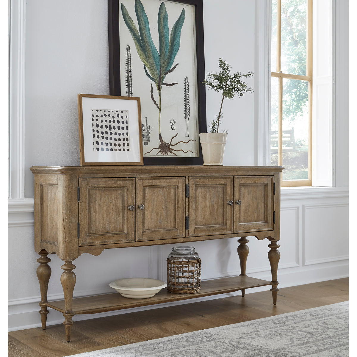 a wood cabinet with a picture on the wall