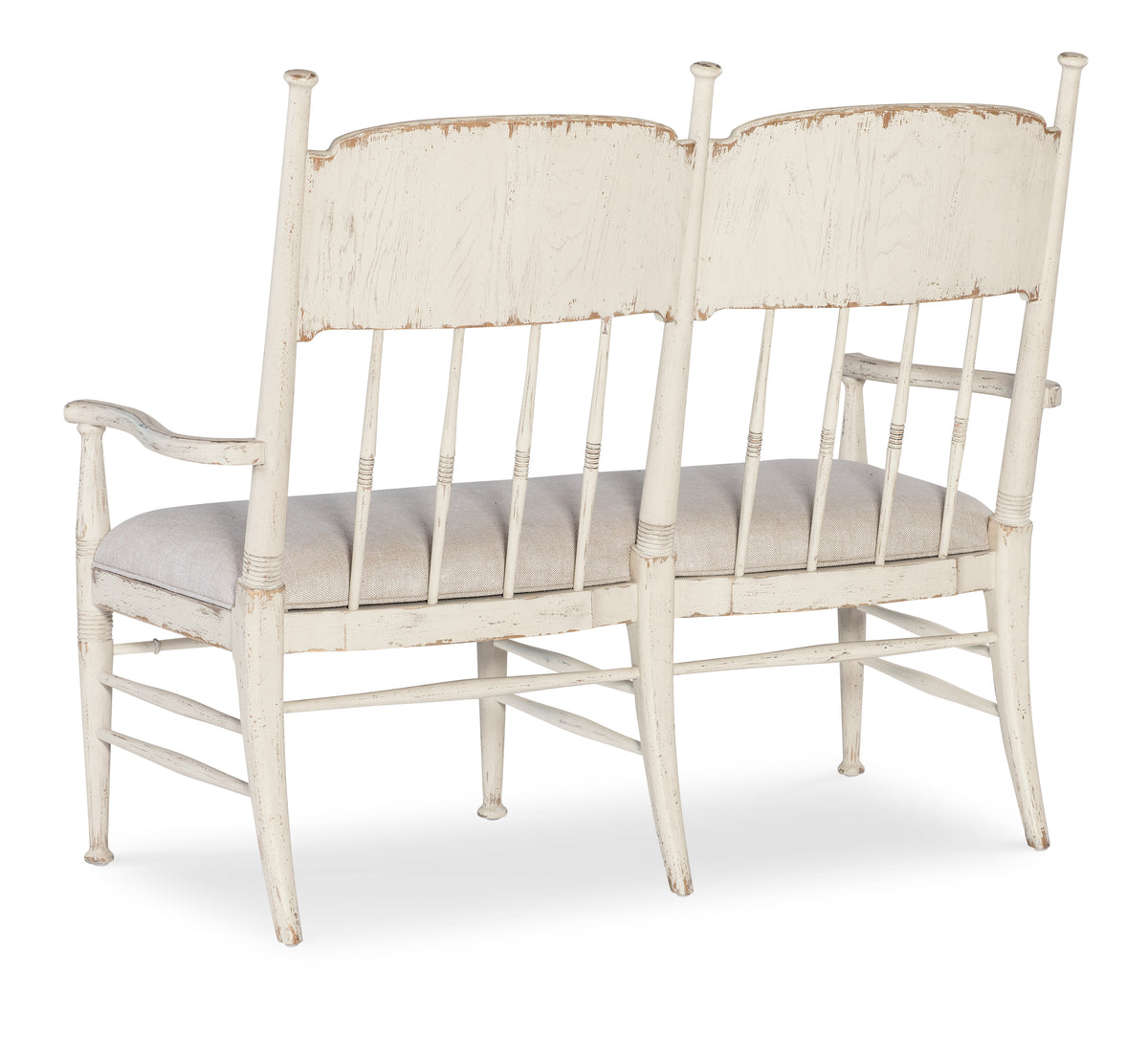 a white bench with a cushion