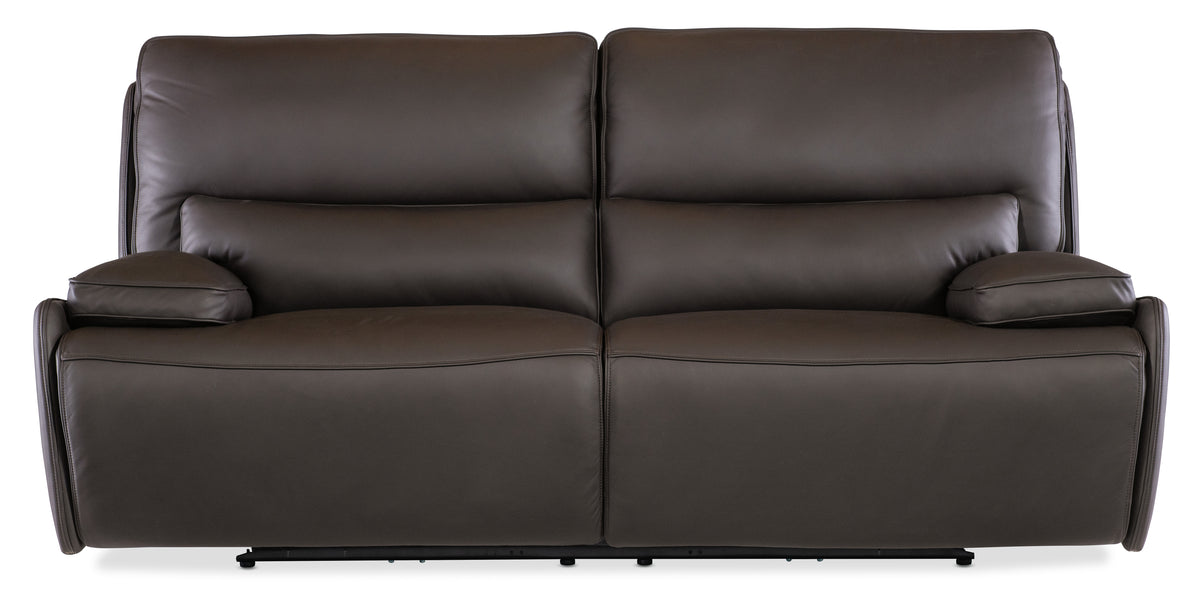 a brown couch with two pillows