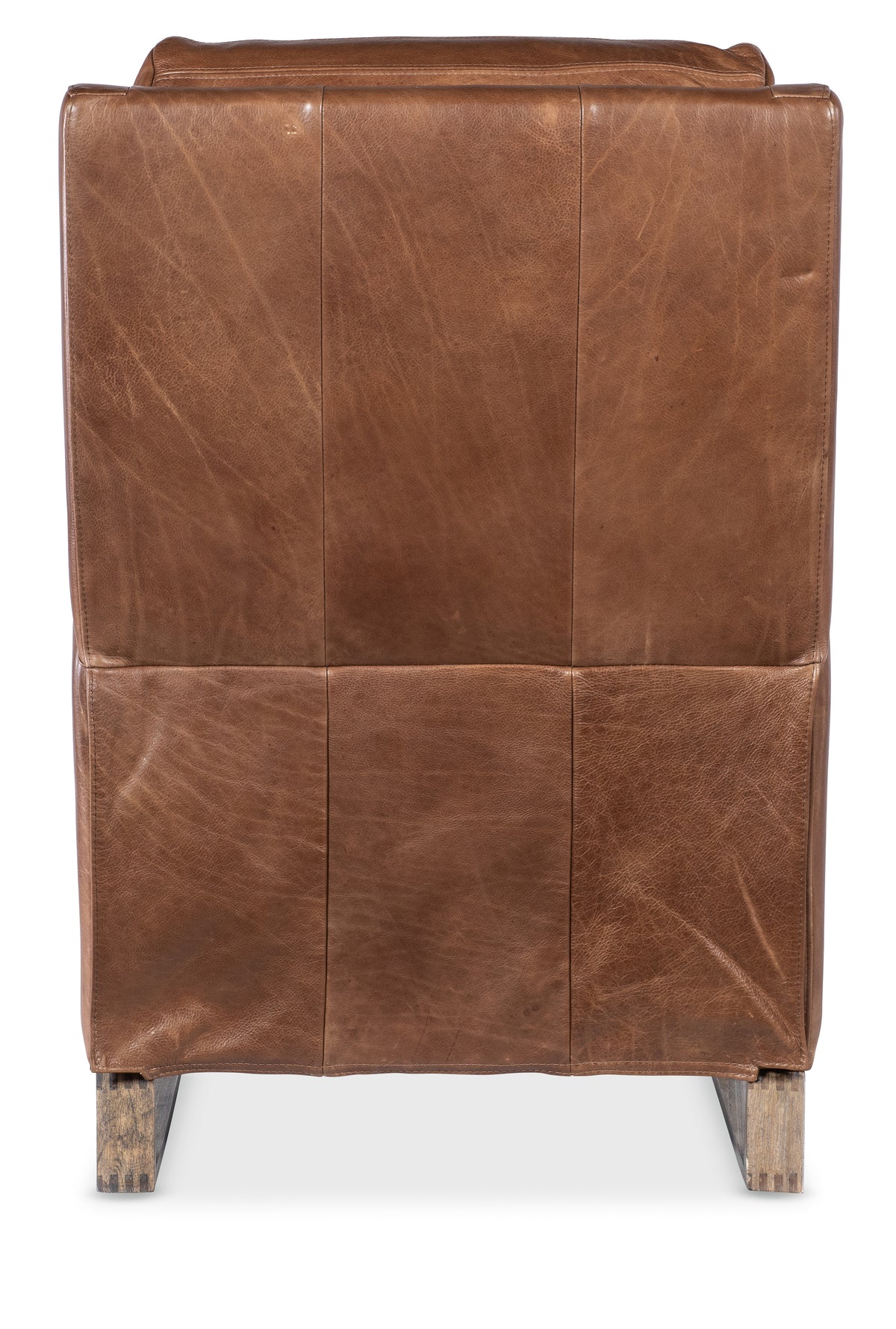 a brown leather chair with wooden legs