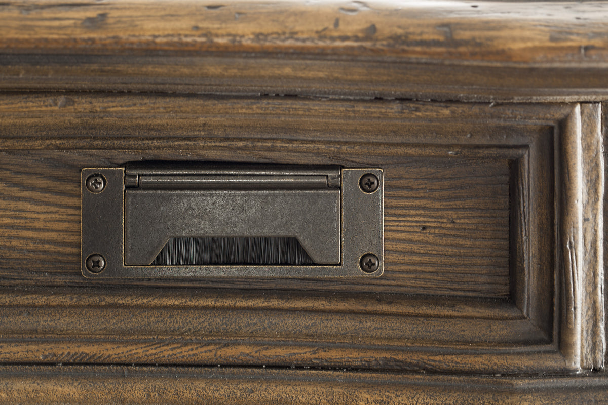 a metal object on a wood surface