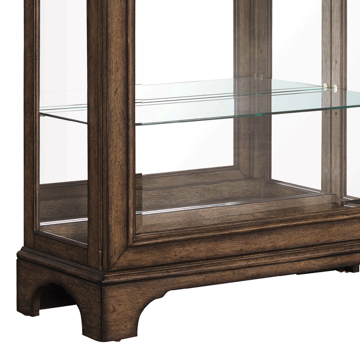 a glass shelf on a wood shelf
