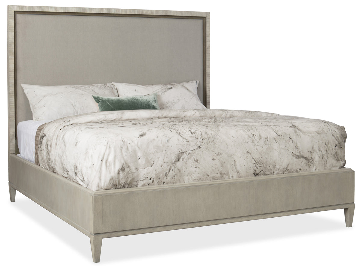 a bed with a white and grey bed frame