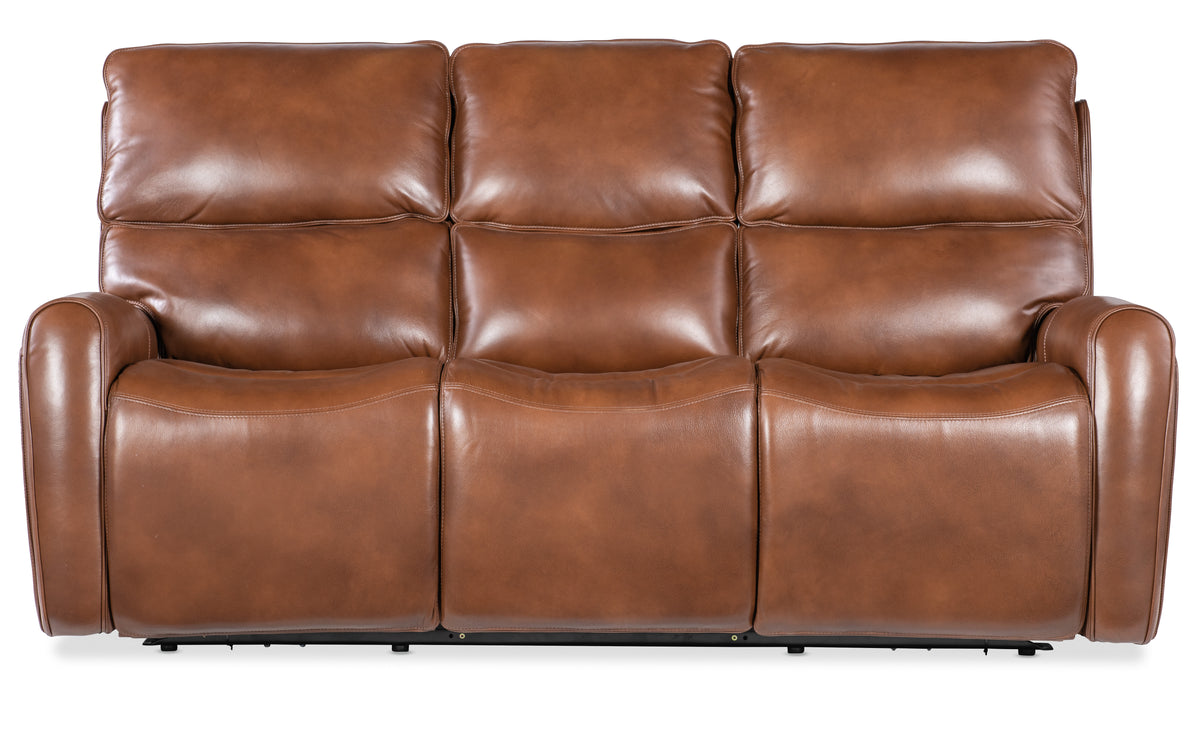 a brown leather couch with reclining arms