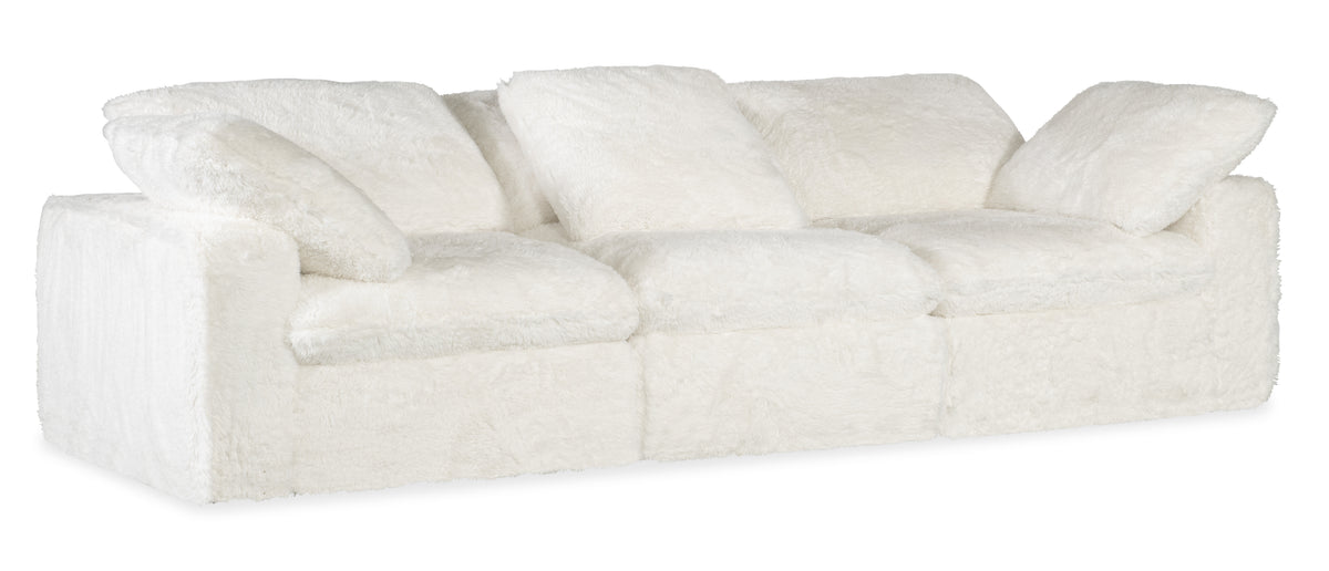 a white couch with pillows
