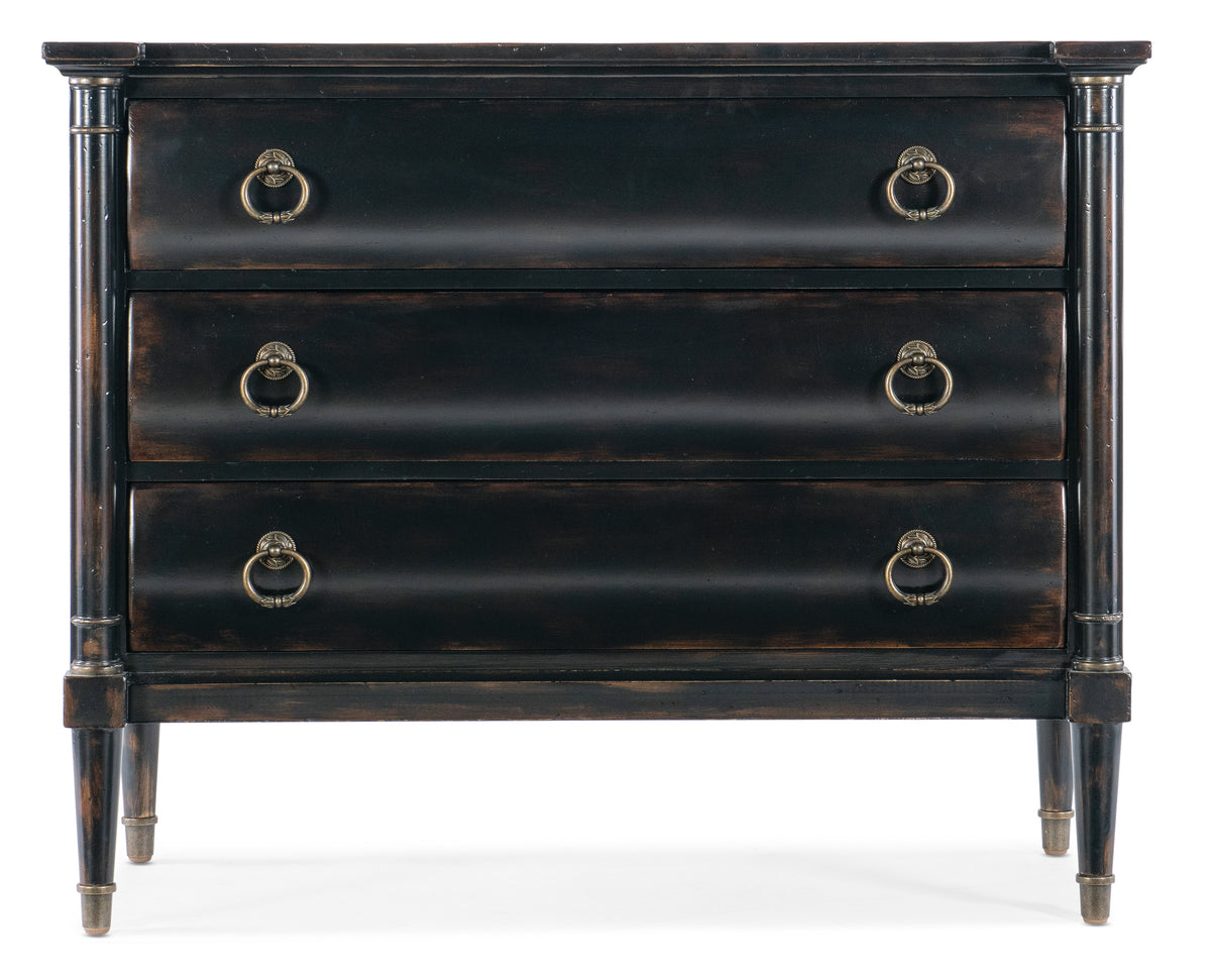 a black dresser with gold handles