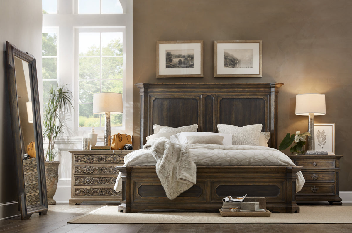 a bedroom with a bed and a lamp