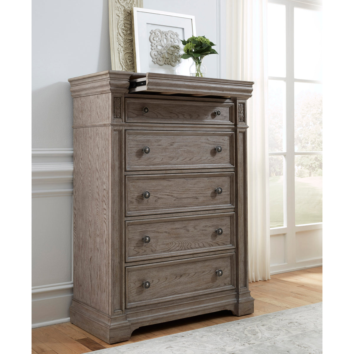a dresser with a picture on top