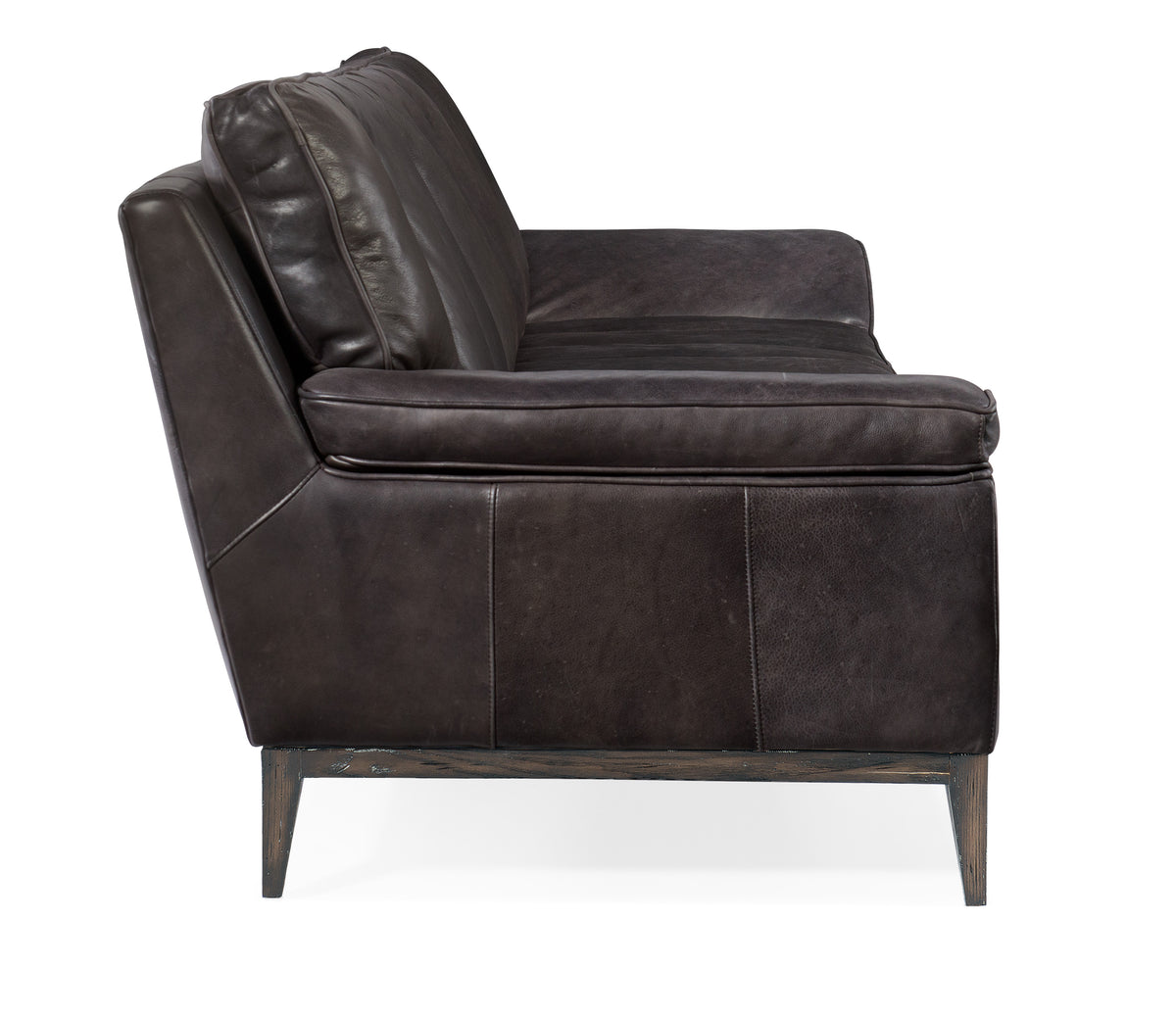 a black leather couch with wooden legs