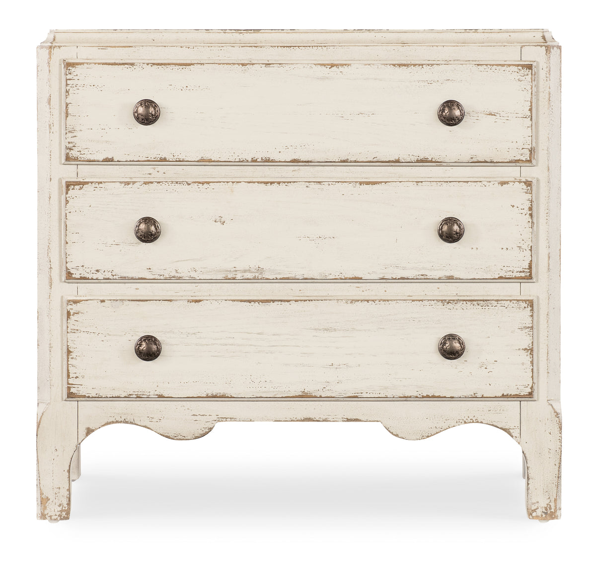 a white dresser with three drawers