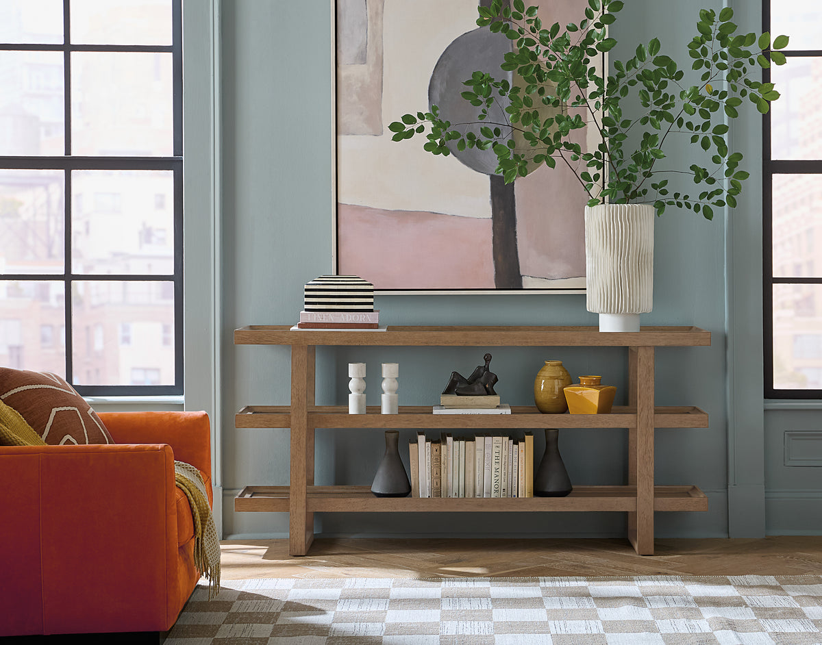a living room with a couch and a painting