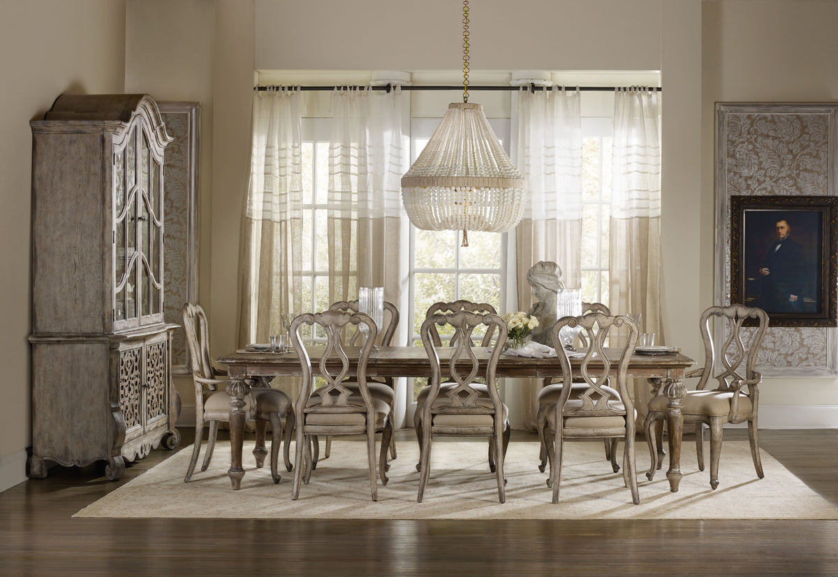 a dining room with a chandelier and a table