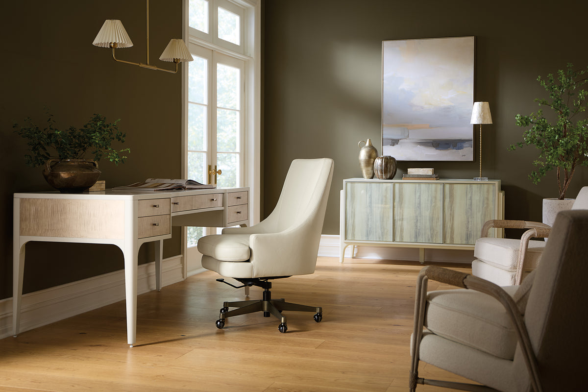a room with a white chair and a white desk