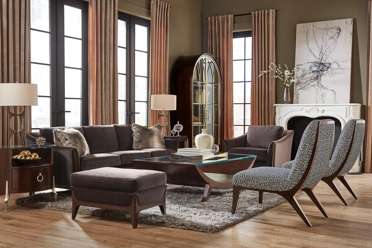 a living room with a couch and chairs