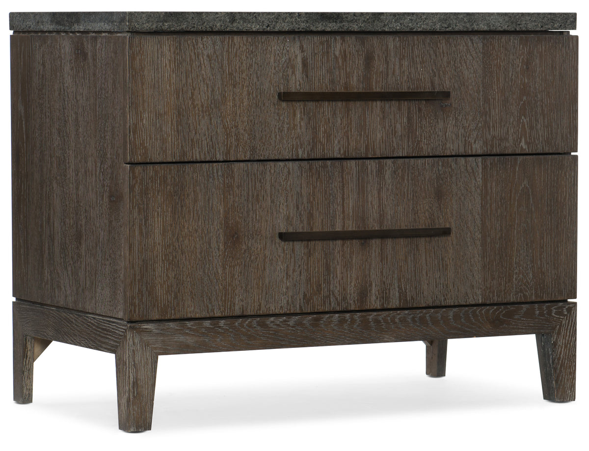 a brown dresser with a marble top