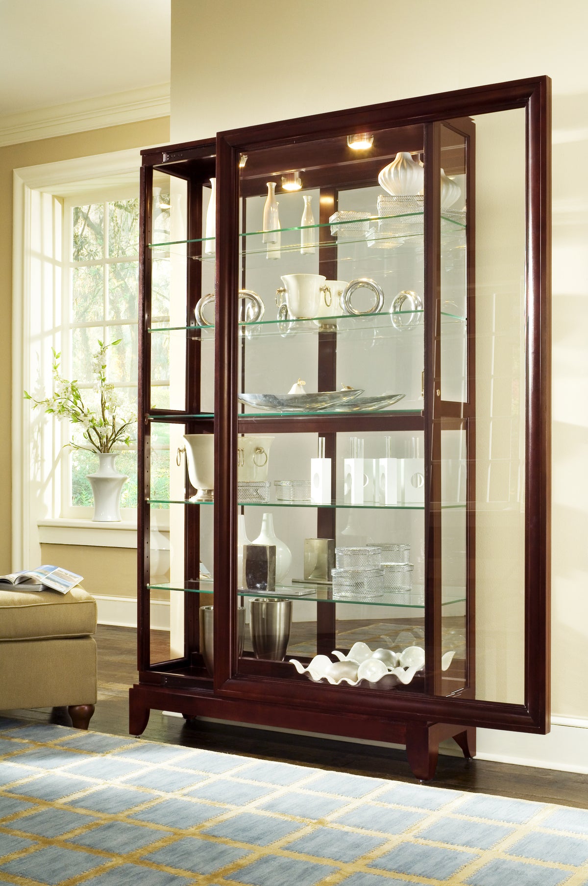 a glass cabinet with a shelf