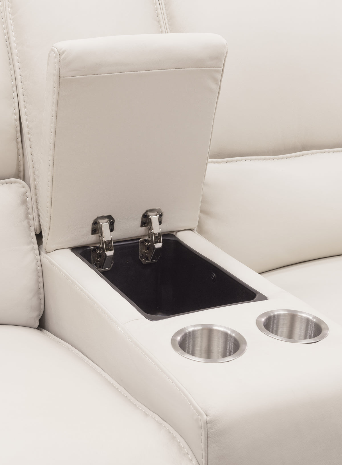 a white couch with a cup holder