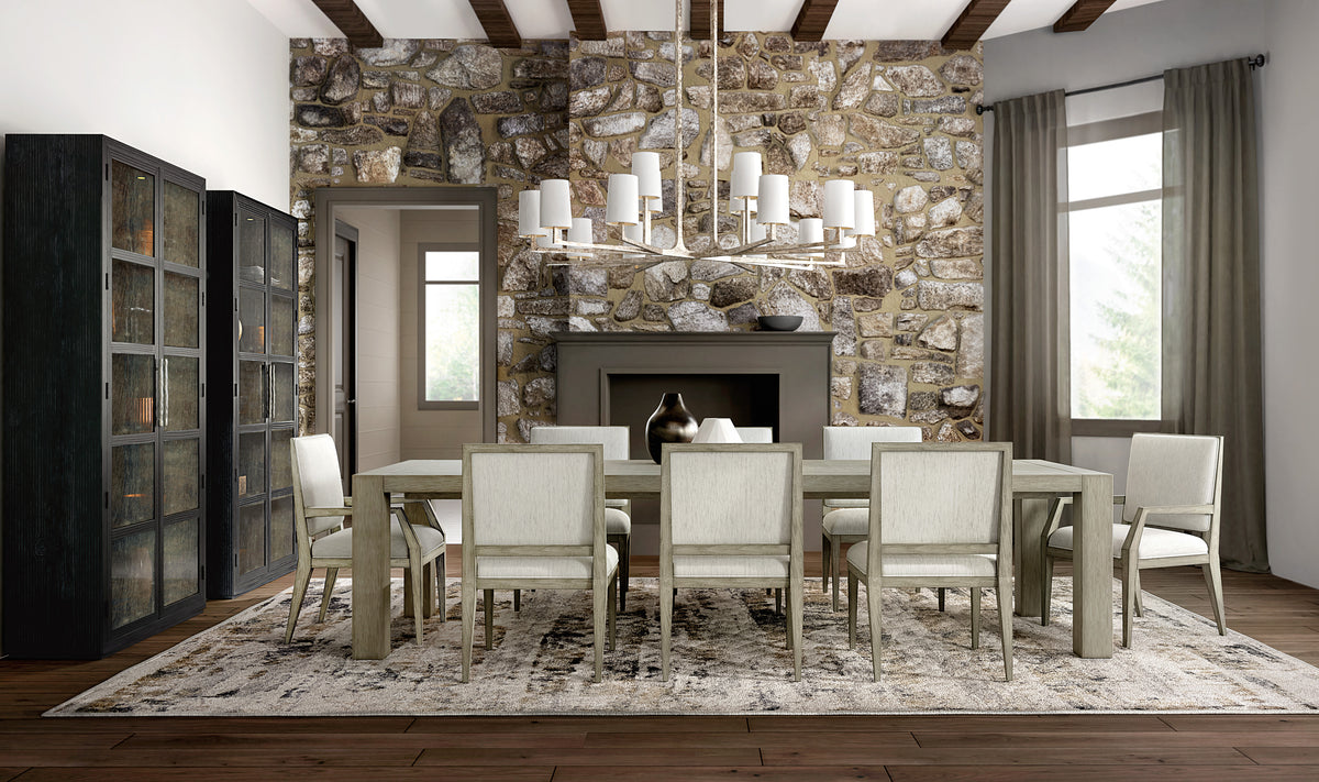 a dining room with a fireplace and a table