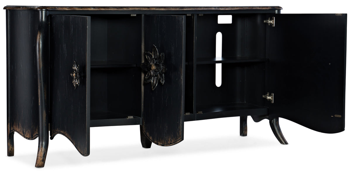 a black wooden cabinet with a flower on the side