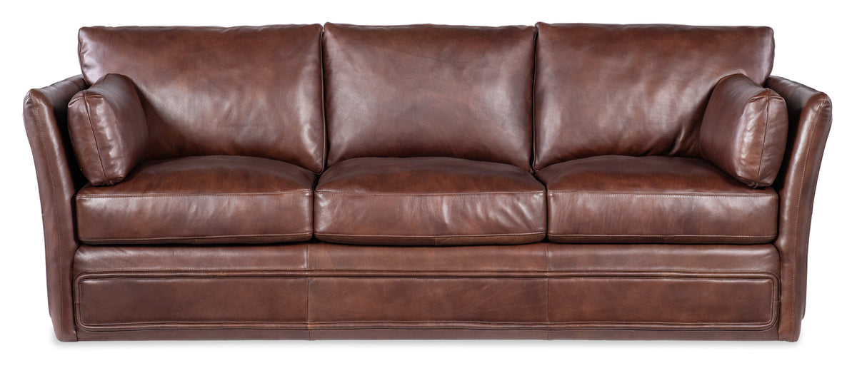 a brown leather couch with cushions