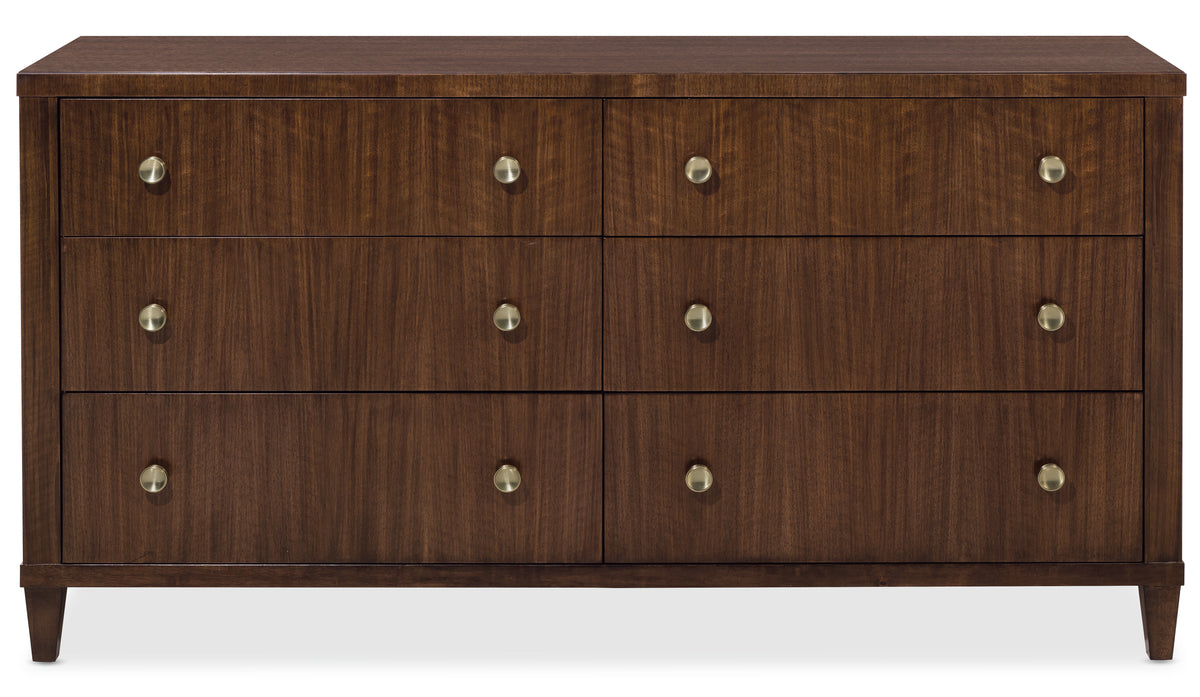 a brown dresser with gold knobs