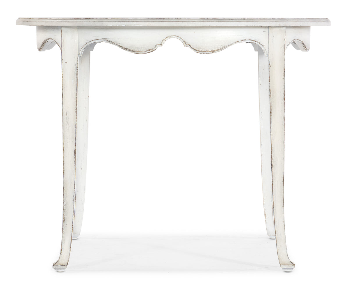 a white table with a scalloped edge