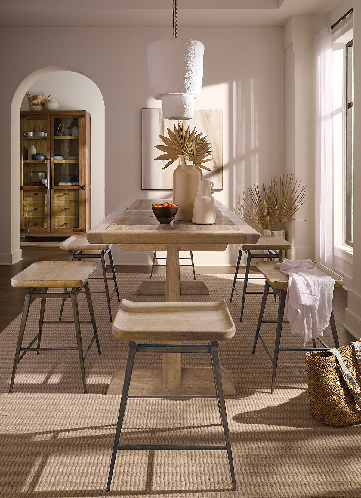 a table and stools in a room