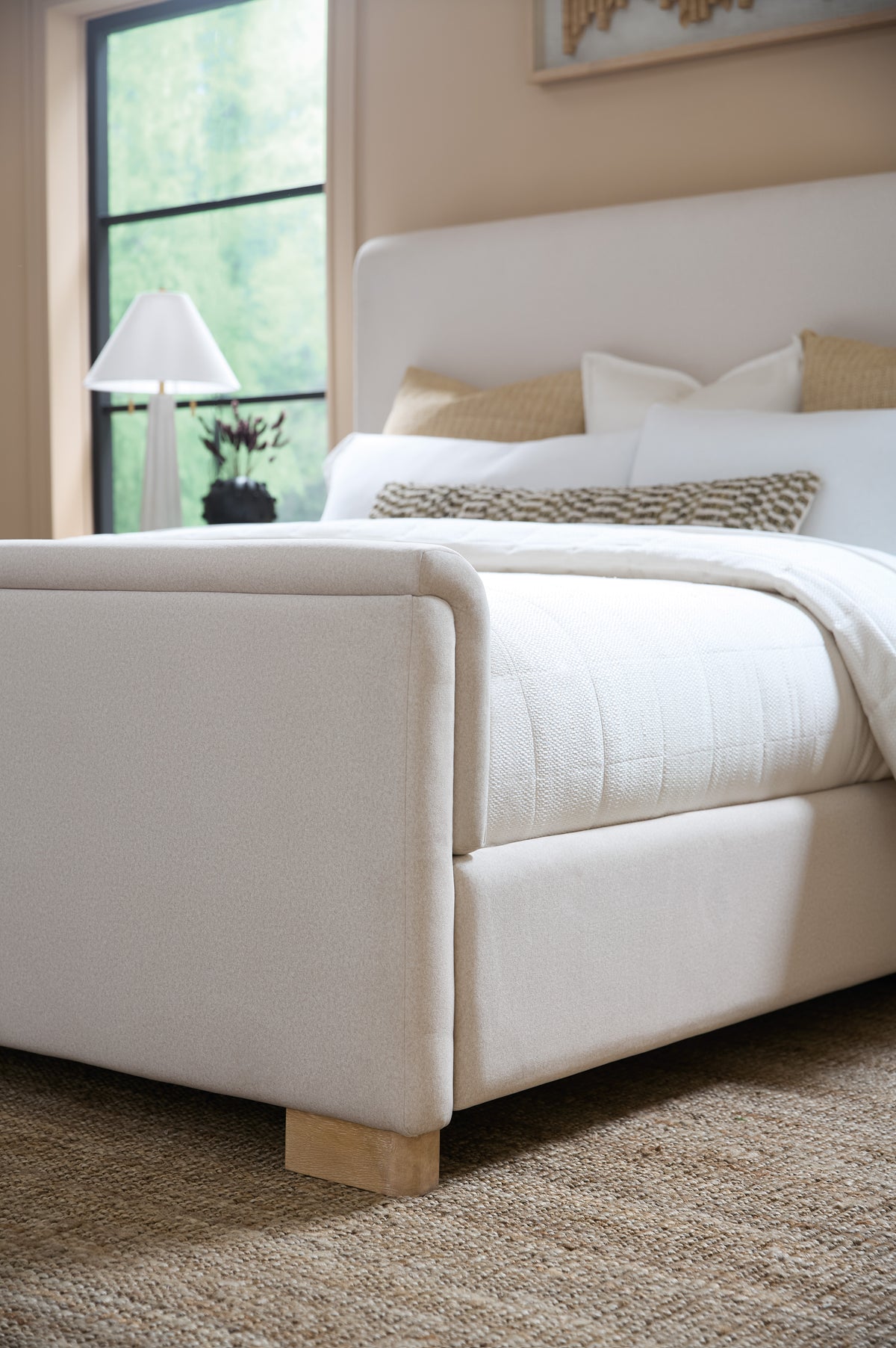 a bed with a white bed frame