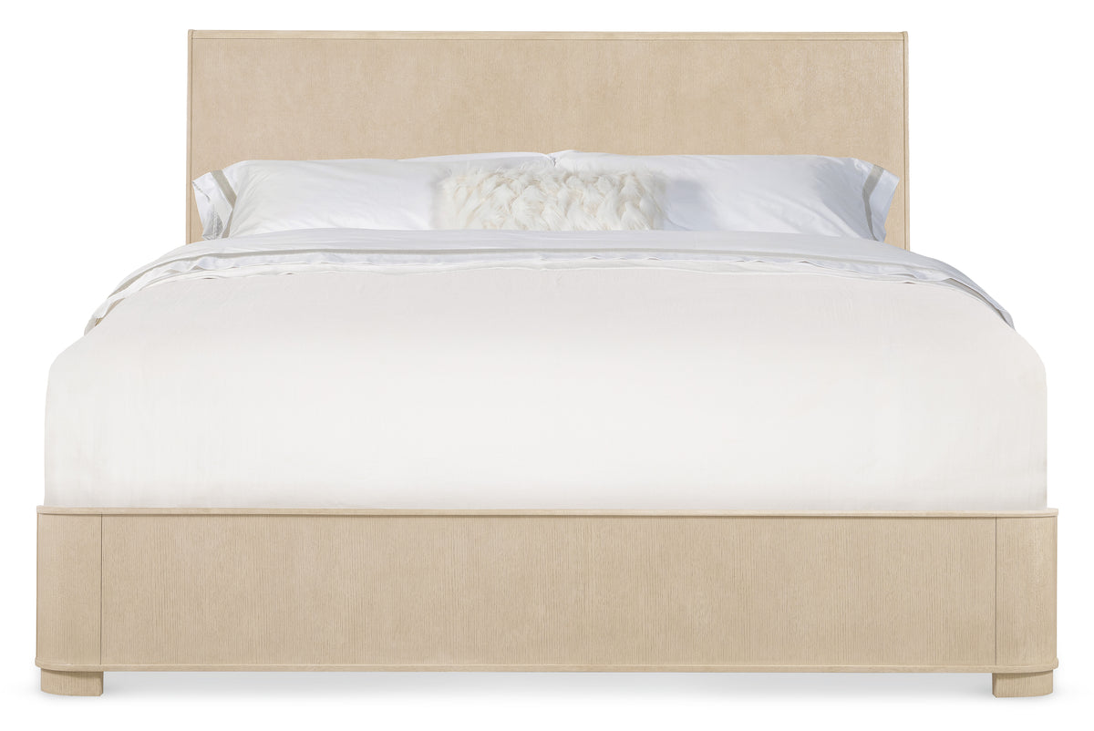 a bed with a white headboard