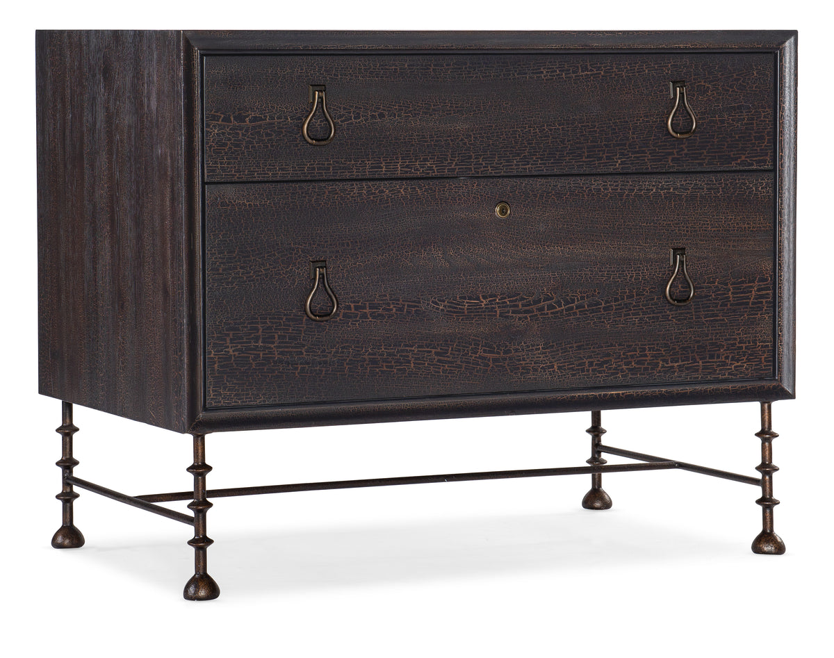 a brown dresser with metal legs