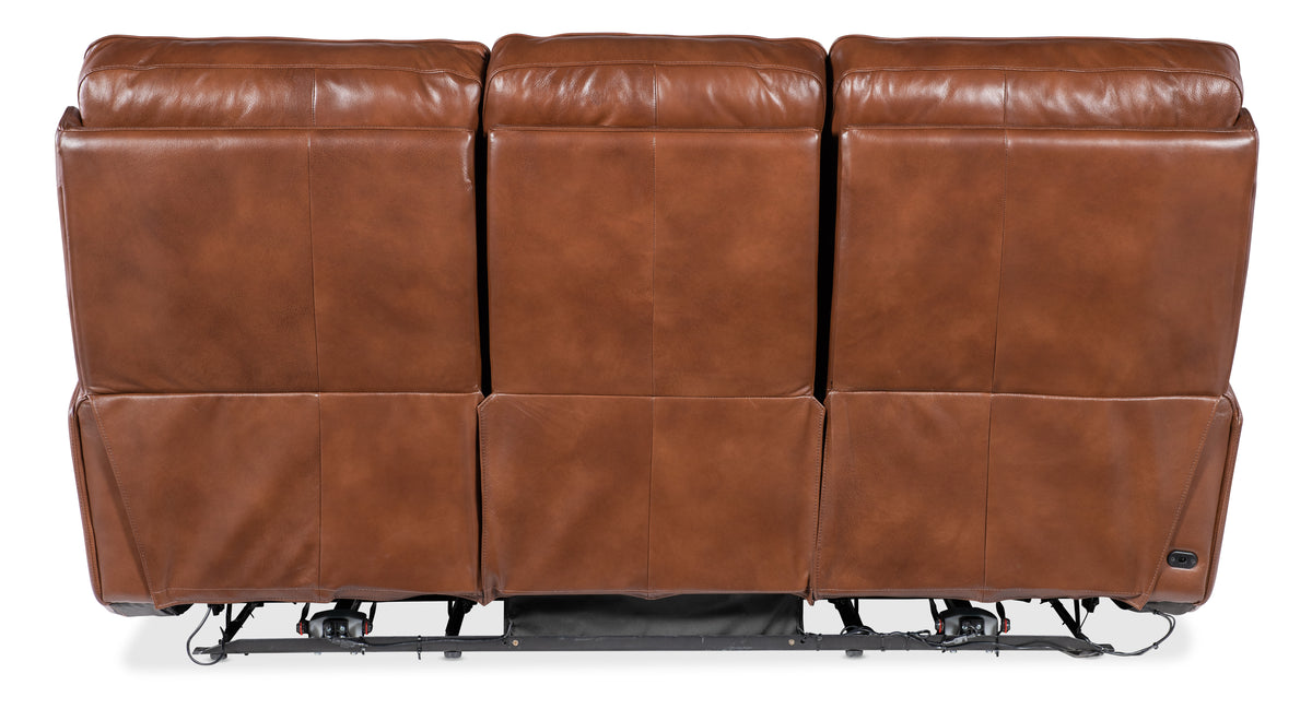a brown leather couch with wheels