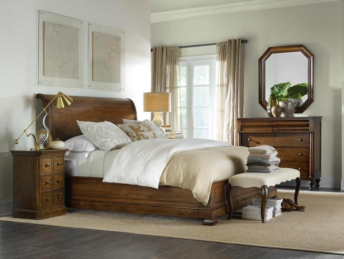 a bedroom with a bed and dresser
