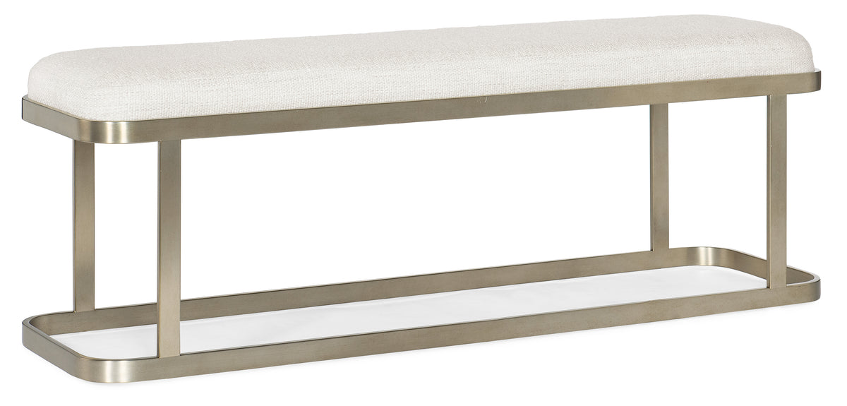 a white bench with a white cushion