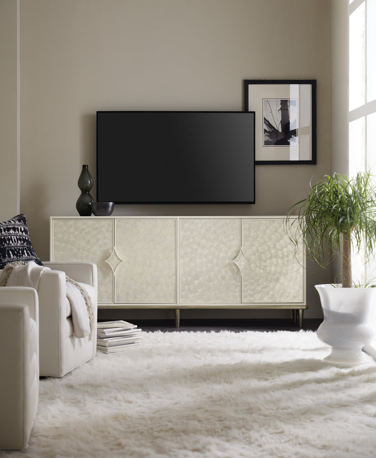 a living room with a tv on the wall