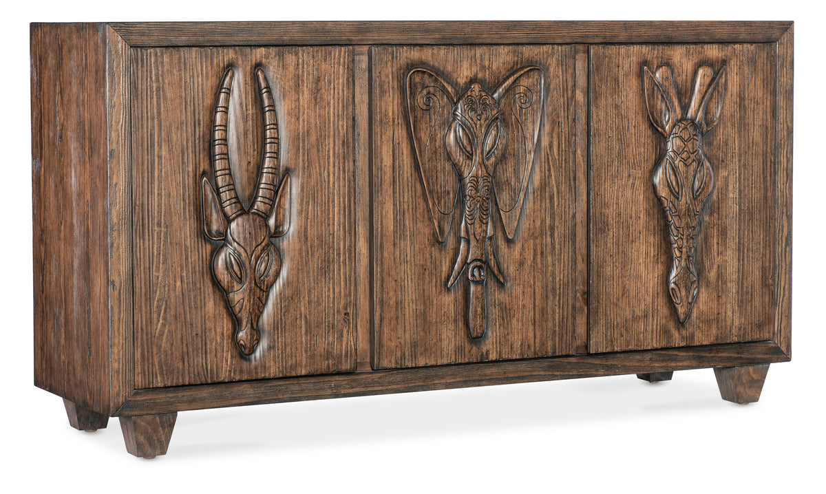 a wooden cabinet with carved animals