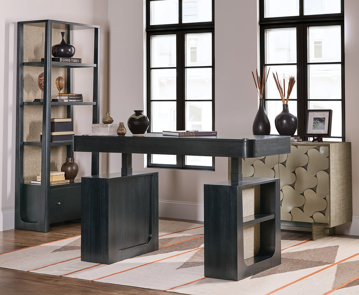 a room with a desk and shelves