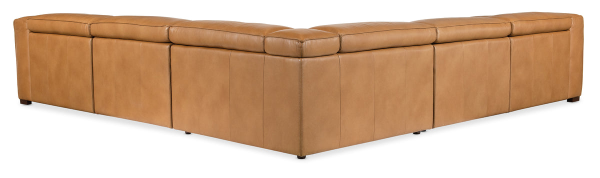 a brown leather corner chair