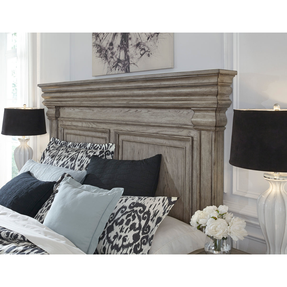a bed with black lamps