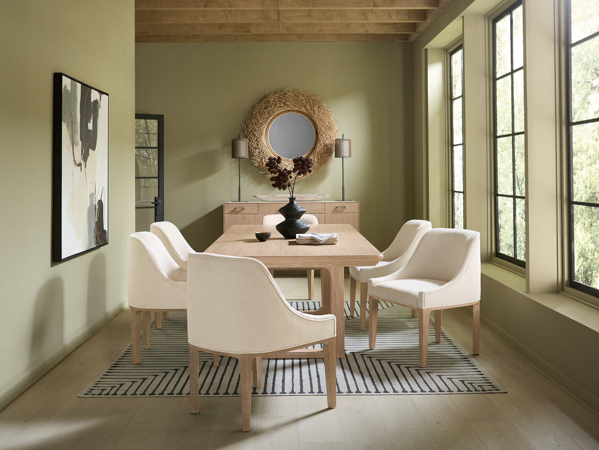 a dining room with a table and chairs