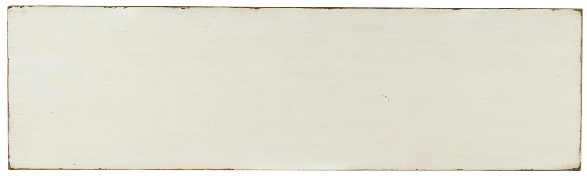 a white rectangular object with brown edges