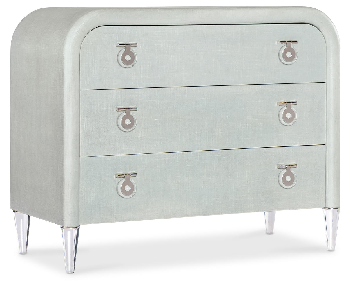 a white dresser with silver handles