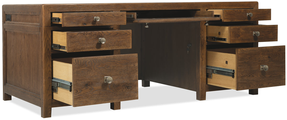 a wooden desk with drawers