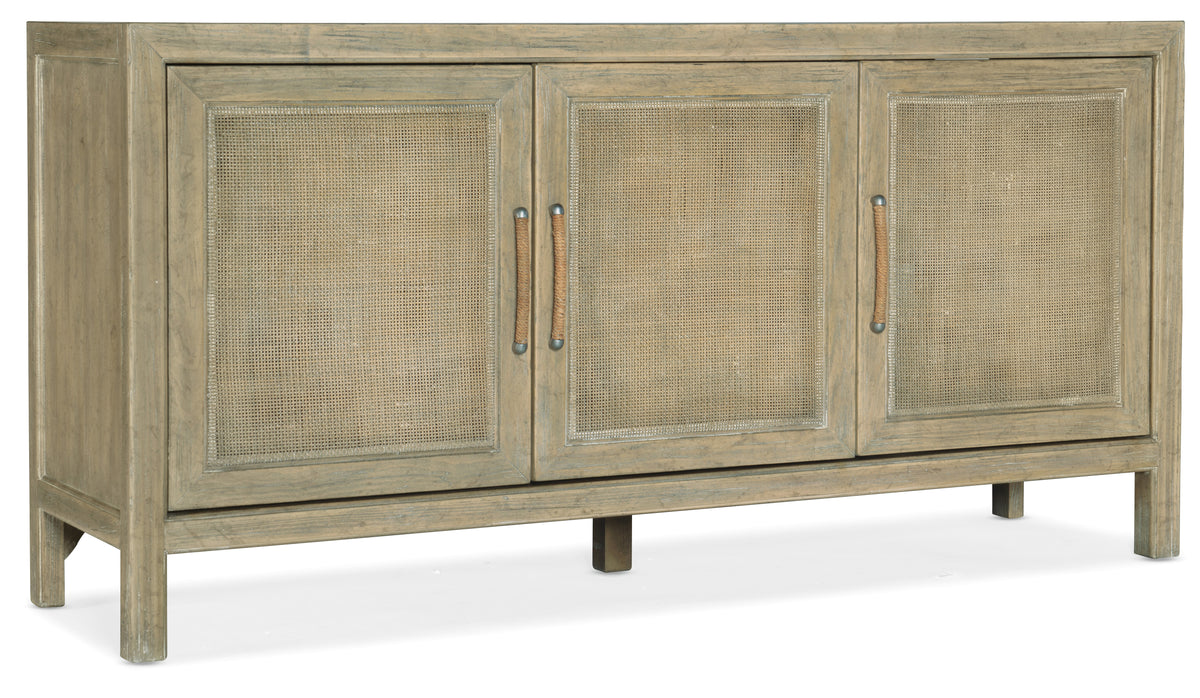 a wooden cabinet with wicker doors