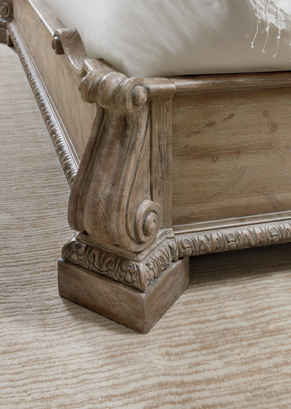 a wood carved bed frame