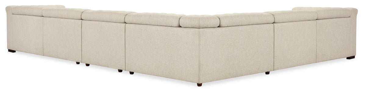 a white couch with a pair of pillows
